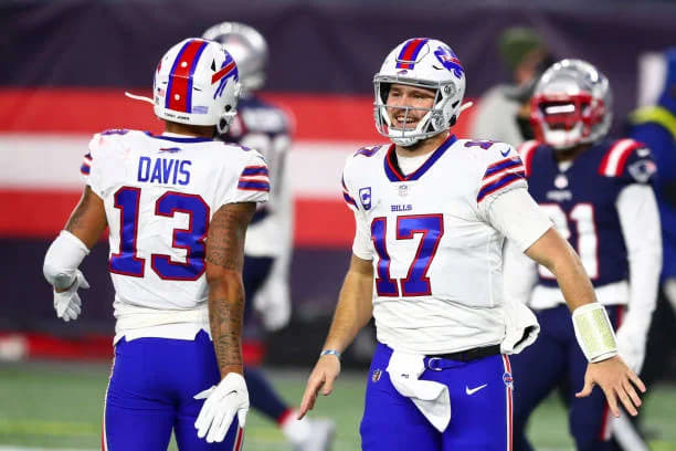 Allen and Davis celebrate together during a game against the New England Patriots.